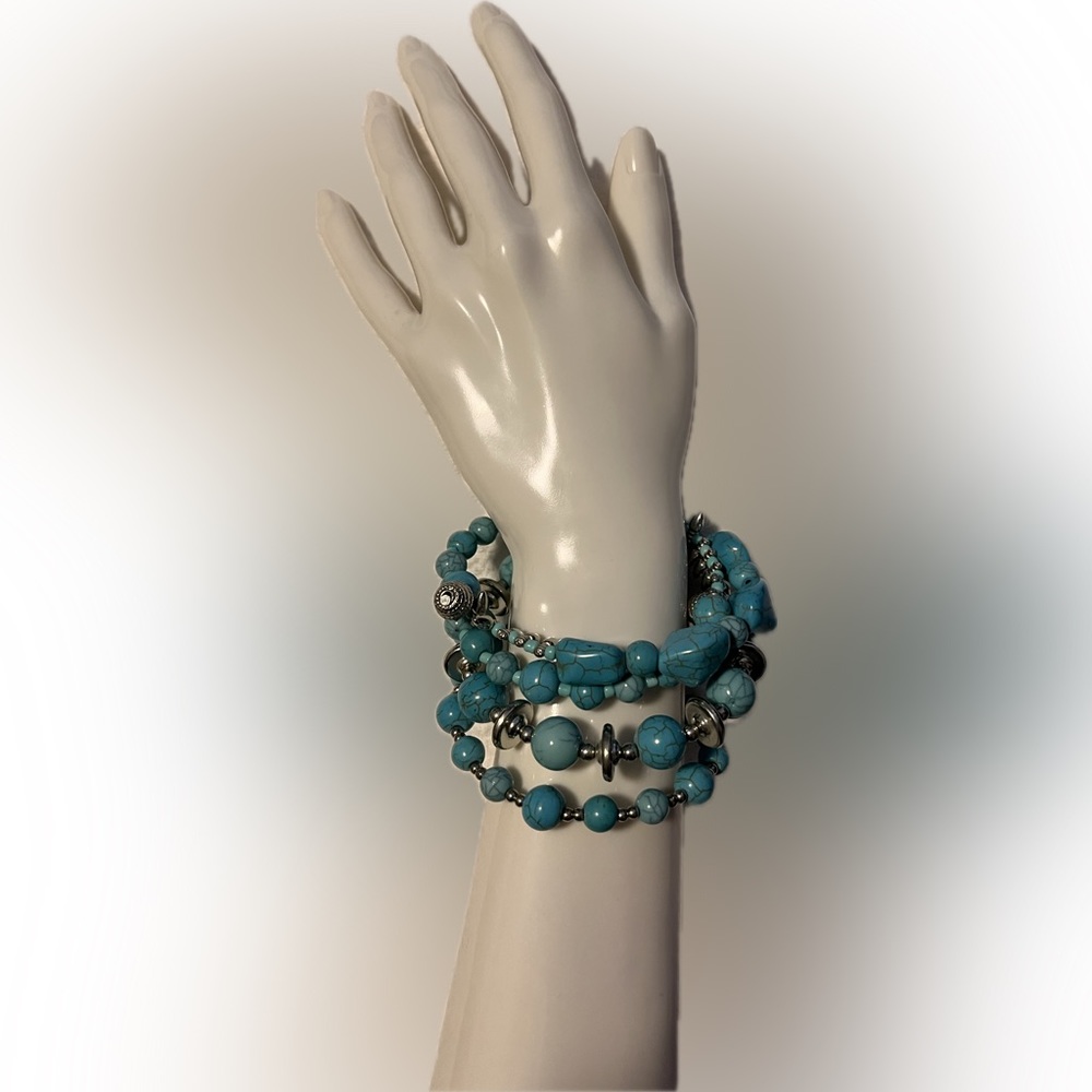 Turquoise or turquoise colored multi strand bracelet